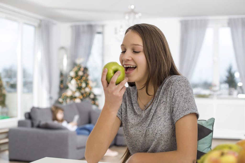 Female eating an apple